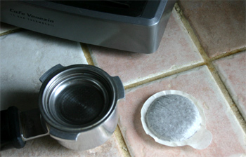 An E.S.E. espresso pod and portafilter.