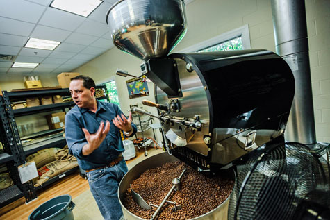 Ed Freedman of Shearwater Organic Coffee Roasters with his small-batch roaster.