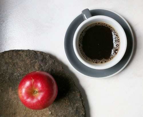 Apple and a cup of coffee