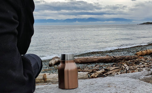 Asobu Cold Brew Insulated Portable Brewer on the beach