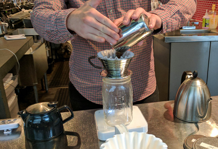 Measuring coffee in an Austin coffee shop
