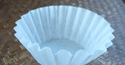 A flat bottom filter paper for a drip coffee maker.