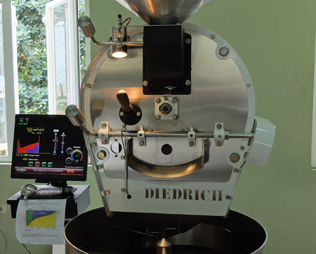 A high-tech coffee roaster, complete with computer and flat-screen monitor.