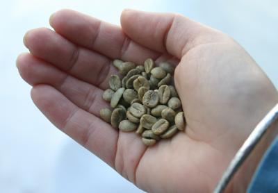 A small handful of green coffee beans.