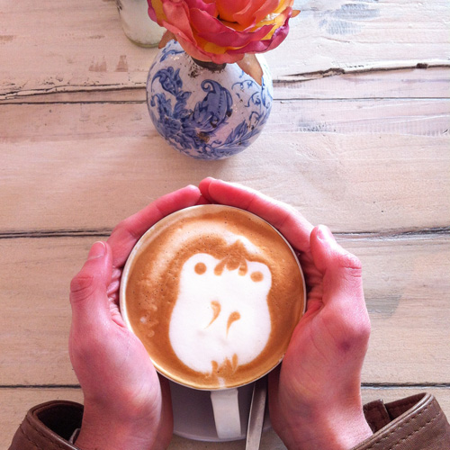 Latte art with hands.