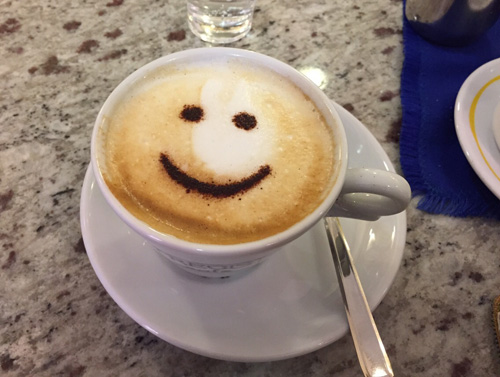 Smiley face on coffee.