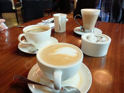 Family brunch with coffees at King's Cross, London.