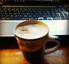 Cappuccino and keyboard.