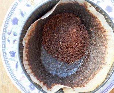 Adding new coffee grounds to coffee that has already been used.