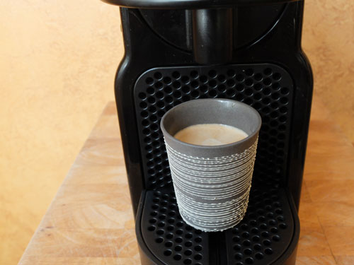 Ceramic espresso cup and Nespresso machine