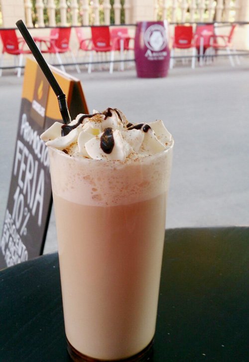 Cold coffee with cream and sprinkles.