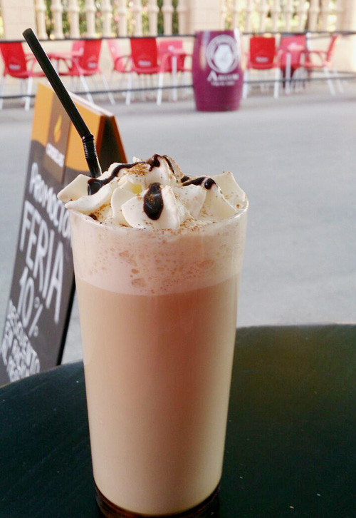 Iced latte in a tall glass.