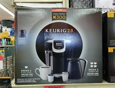 The Keurig 2.0 brewer in its box.