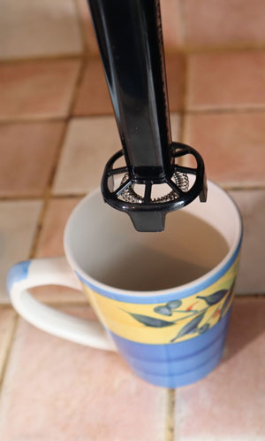 The system comes with a whisk you can use to froth milk for your specialty coffees.