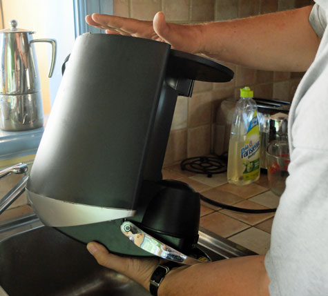 Clearing air from the water pump of a Keurig brewer.