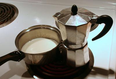 Bialetti and a saucepan of milk.