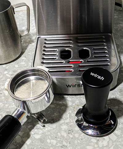 The Wirsh drip tray, portafilter, and tamping tool.